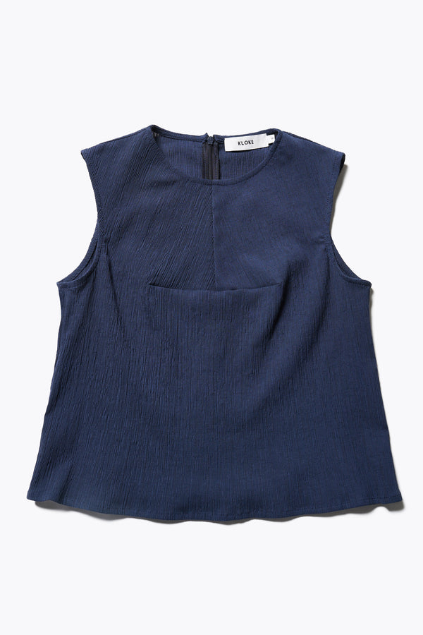 Aeon Crinkle Top in Ink, featuring a sleeveless design, panelled bustline, high neckline, and concealed back zip. Crafted from structured crinkled crepe fabric. Available in 4 sizes.