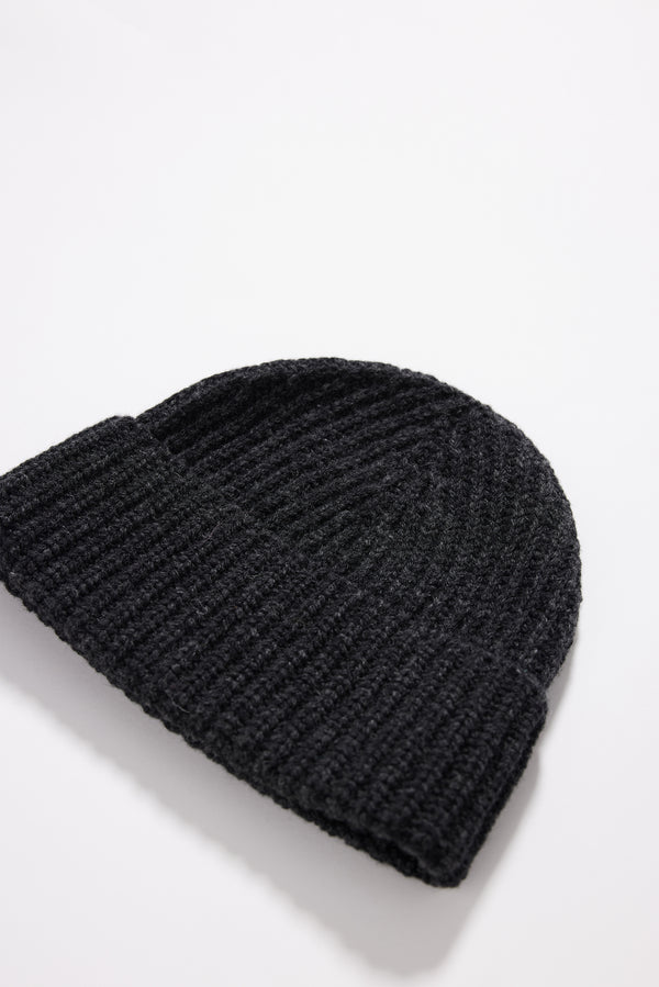 Charcoal Fading Beanie flat lay showing ribbed half-cardigan knit construction and contemporary proportions in RWS certified Merino
