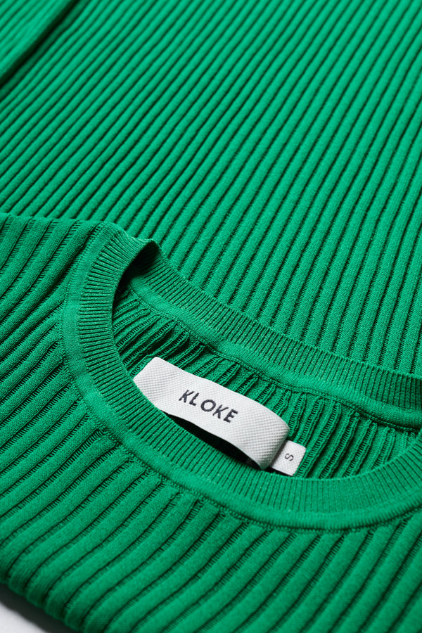 Close-up of the Green Verse Knit Tee drop-stitch knit and rib trims.