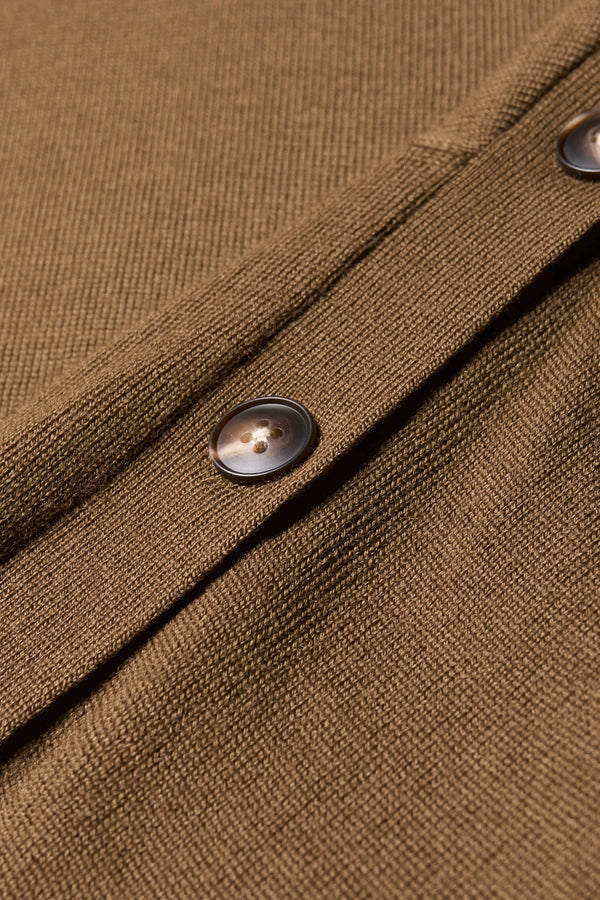 Close up fabric detail of the Impart Mock neck Sweater in Merino wool with Button detailing along the shoulders