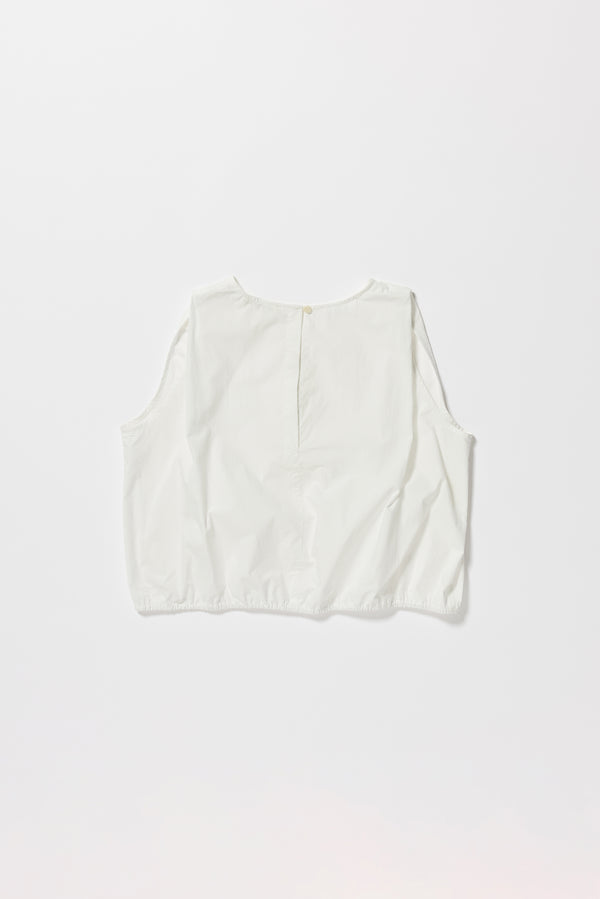 Flat back of the Lambent Top back view showing round neckline and keyhole button closure