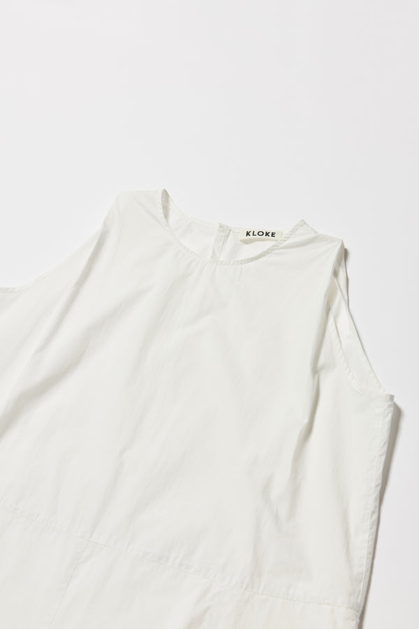 Close up details of the white Aureole Dress front view showing panelled detailing 