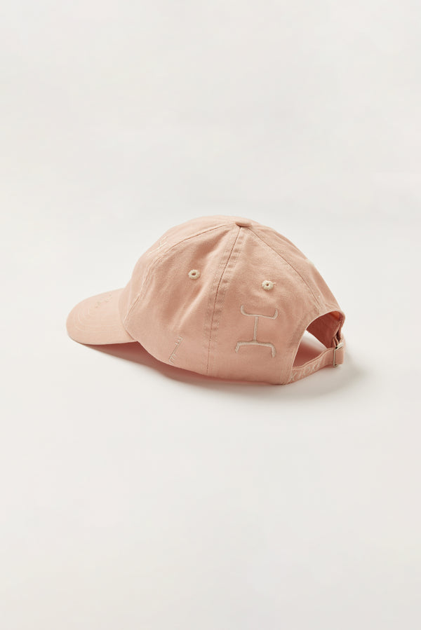 Unisex Ancient Language Cap in Pink, featuring all-over embroidered motifs inspired by Vinča markings