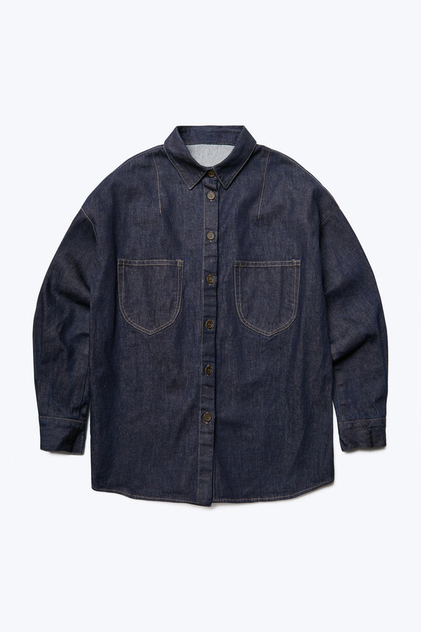 The front of Barium Denim Shirt Indigo cut from Japanese denim with contrast topstitch with two front patch pockets. This shirt can be worn buttoned up or worn open as an outer layer.