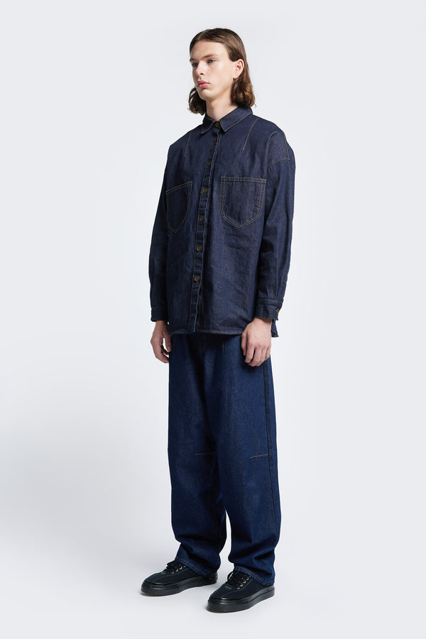 The Barium Denim Shirt Indigo, a buttoned up shirt with a crisp shape and cut from Japanese denim. Features two front patch pockets. 