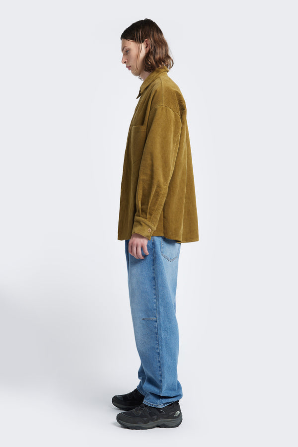 Side profile of the Corner Cord Shirt Golden Tan, a long sleeve shirt made from thick-wale corduroy that’s structured and warm.