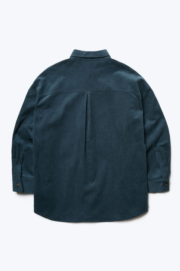 Flat lay of the back of the Corner Cord Shirt Petrol Blue, a loose fitting, long sleeve shirt made from thick wale corduroy.