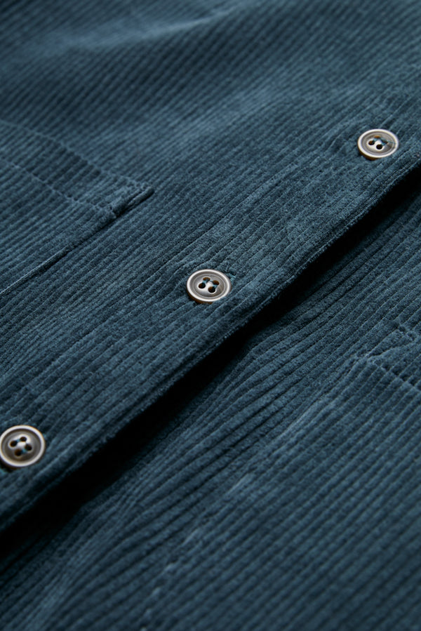 Close up of the Corner Cord Shirt buttoned up, made from thick wale corduroy in Petrol Blue.