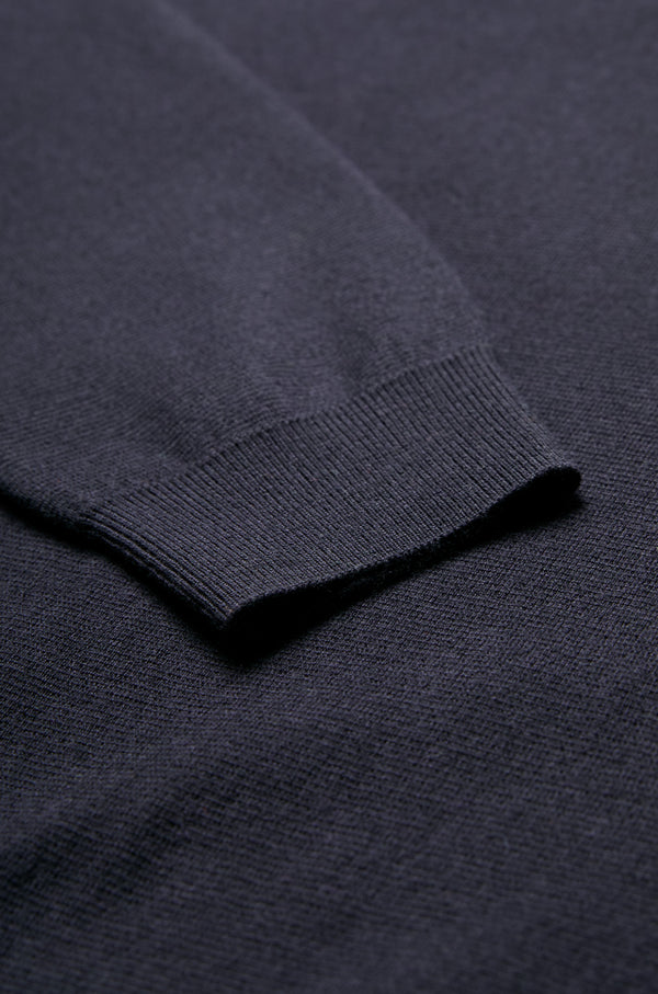 Close up of the Dose Merino Knit Sweater in Ink and ribbed cuffs. This Sweater is made from 100% Merino.
