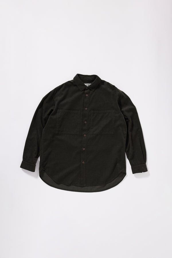 Flat front of brown Equinox Cord Shirt worn buttoned, showing relaxed silhouette, oversized front patch pockets and centre-front button placket in double over-dyed cotton corduroy
