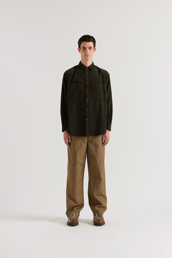 Brown Equinox Cord Shirt worn buttoned, showing relaxed silhouette, oversized front patch pockets and centre-front button placket in double over-dyed cotton corduroy
