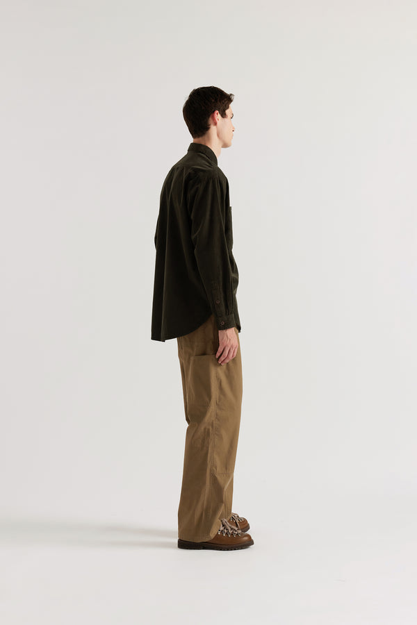 Side view of the brown Equinox Cord Shirt showing relaxed silhouette, curved hem and oversized patch pocket in double over-dyed cotton corduroy

