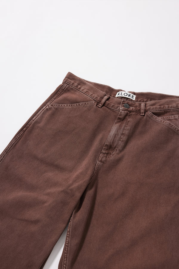 Close-up of the oversized coin pocket and twin-needle stitch detailing on the Ethereal Jean in brown fade 