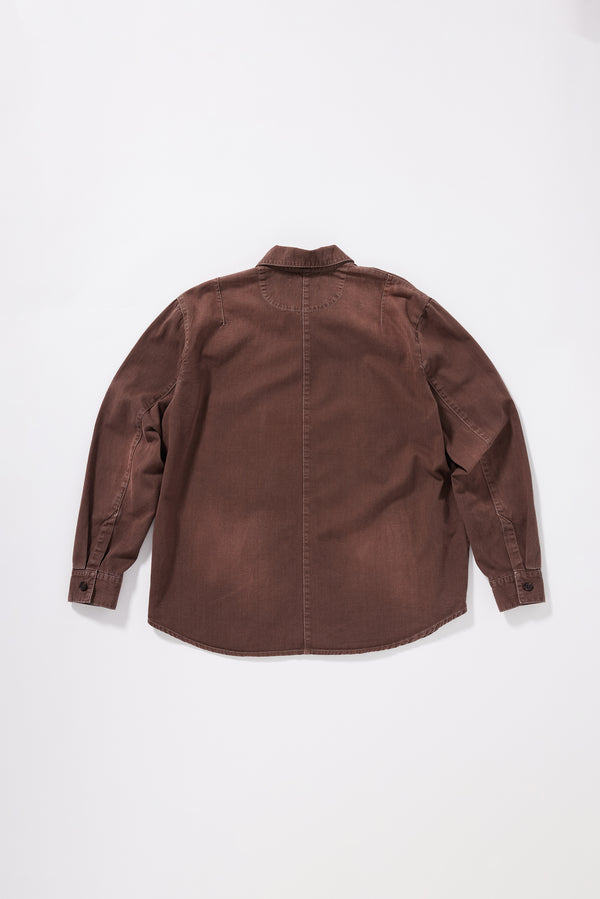 Flat Back view of the float oversized denim shirt in brown fade featuring shoulder darts and a curved hem.