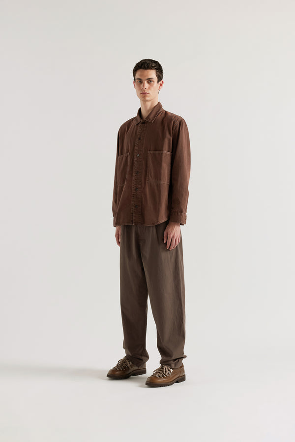 Oversized brown fade denim shirt in 8oz denim with chest pockets, contrast stitching and a garment-dyed stone-wash finish.