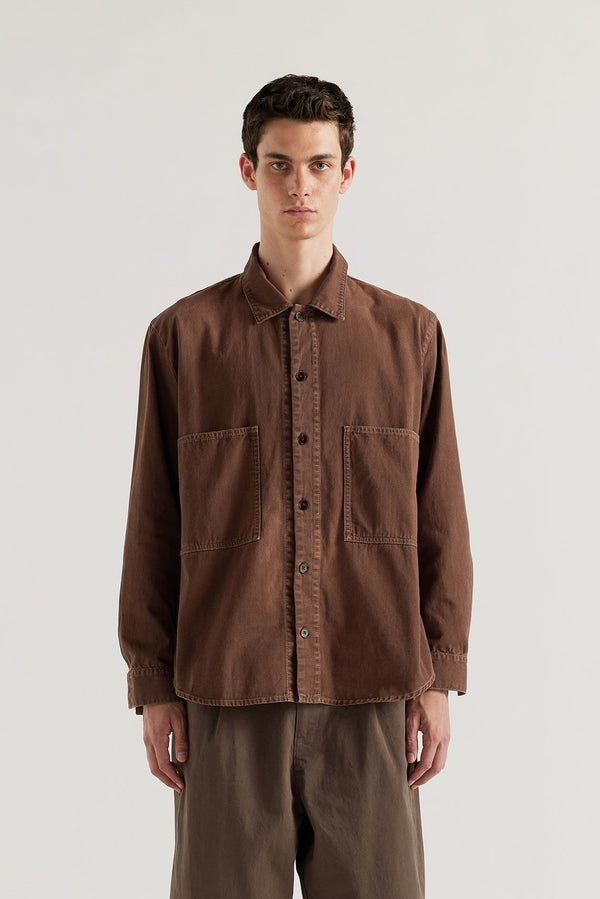 Oversized denim shirt in 8oz denim with chest pockets, contrast stitching and a garment-dyed stone-wash finish.
