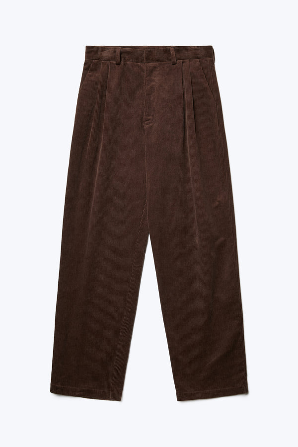 The front of the Intake Pleat Pant Chocolate, a semi-tailored cord pant with a loose, double-pleated fit and featuring side slant-pockets.