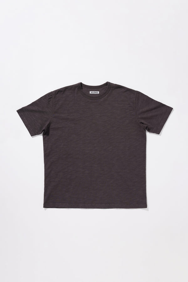 Flat front if the Inverse Tee in pigment-dyed slub cotton with an oversized relaxed fit.