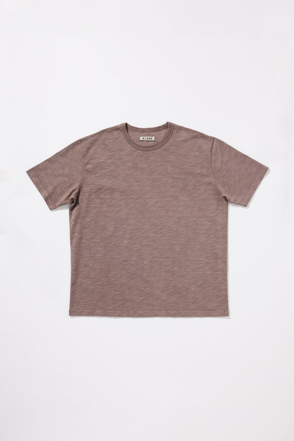 Flat front if the Inverse Tee in pigment-dyed slub cotton with an oversized relaxed fit.