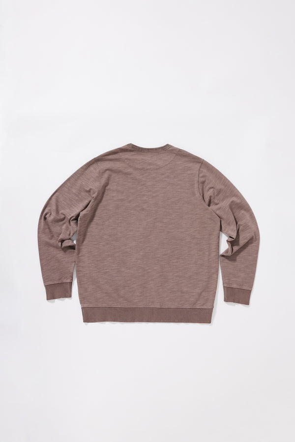 Back view of the relaxed long-sleeve T-shirt featuring a reinforced back yoke.