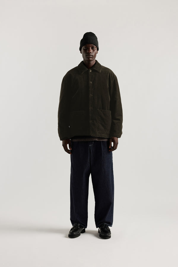 Front view of the Lull Jean in dark indigo Japanese denim with a relaxed loose fit, cargo pockets and elasticated waistband.