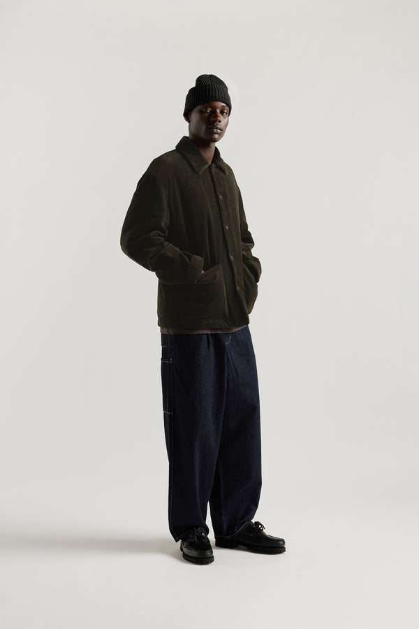 Front view of the Lull Jean in dark indigo Japanese denim with a relaxed loose fit, cargo pockets and elasticated waistband.