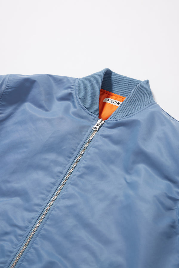 Close-up of the Lyric Bomber Jacket featuring 8mm YKK zip hardware and garment-washed nylon fabric.