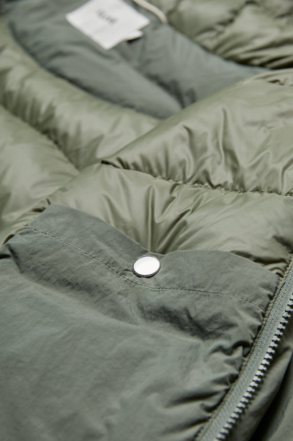 The Majority Quilted Puffer Jacket Olive features an internal breast pocket with press-stud closure.