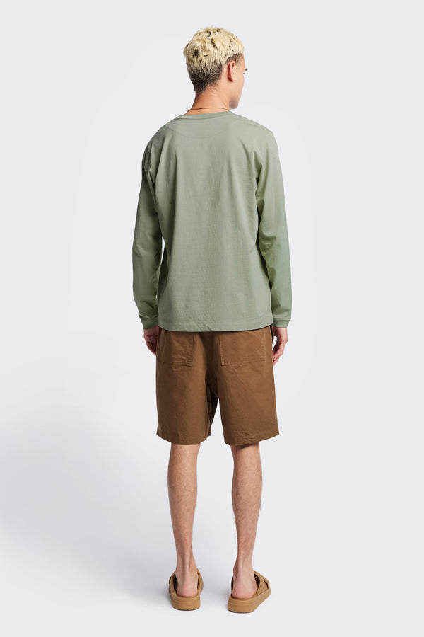 Back of The Offline T-shirt is a long sleeve t-shirt crafted in soft, durable 100% organic cotton in Sage Green. Features rib bound openings and a reinforced back yoke. Available in 5 sizes. 