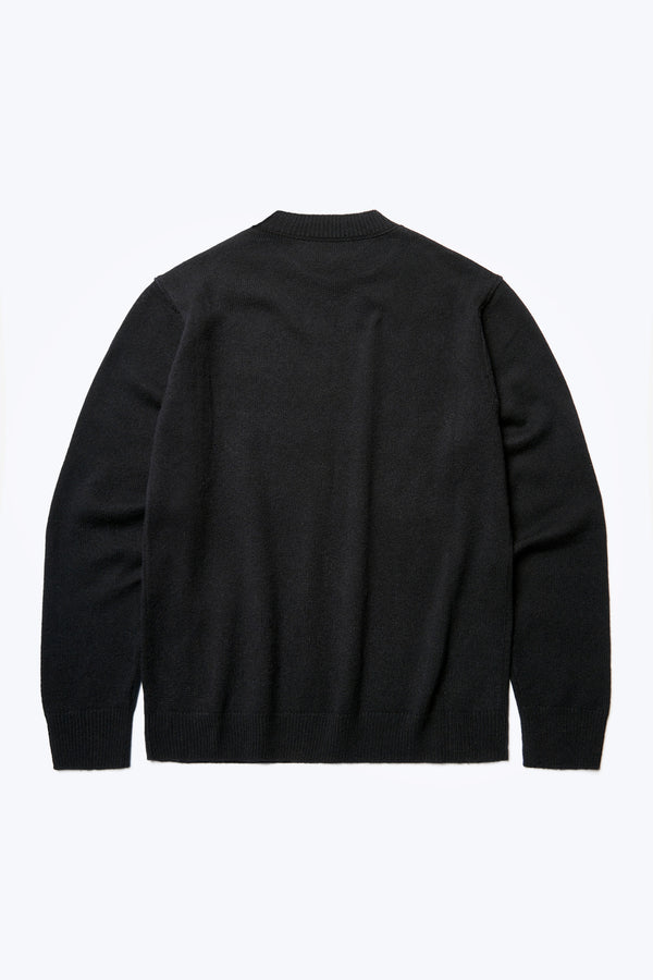 The back of the Photic Cashmere Sweater Black, a relaxed crew neck jumper knitted in a wool/cashmere blend that is soft. 