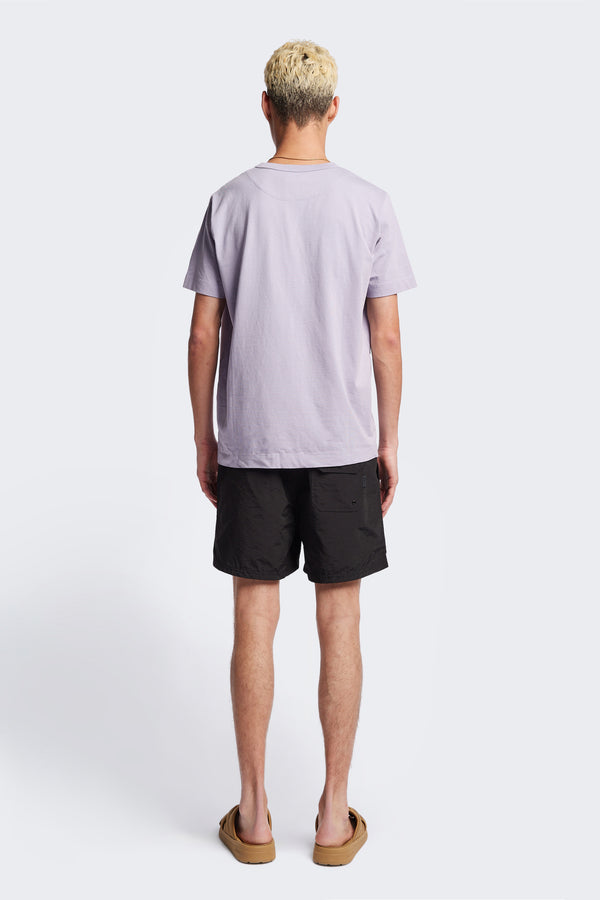 The back of the Radius T-Shirt Lilac, a traditional and relaxed cotton tee with a 1 x 1 rib-bound cover-stitched neckline that's reinforced at the back. 