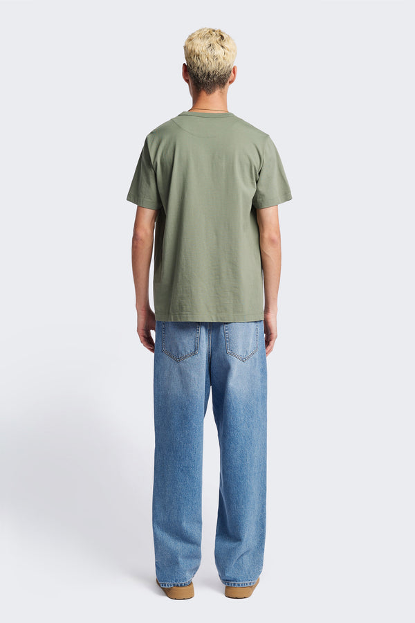 The back of the Radius T-Shirt Sage, a traditional and relaxed cotton tee with a 1 x 1 rib-bound cover-stitched neckline that's reinforced at the back. 