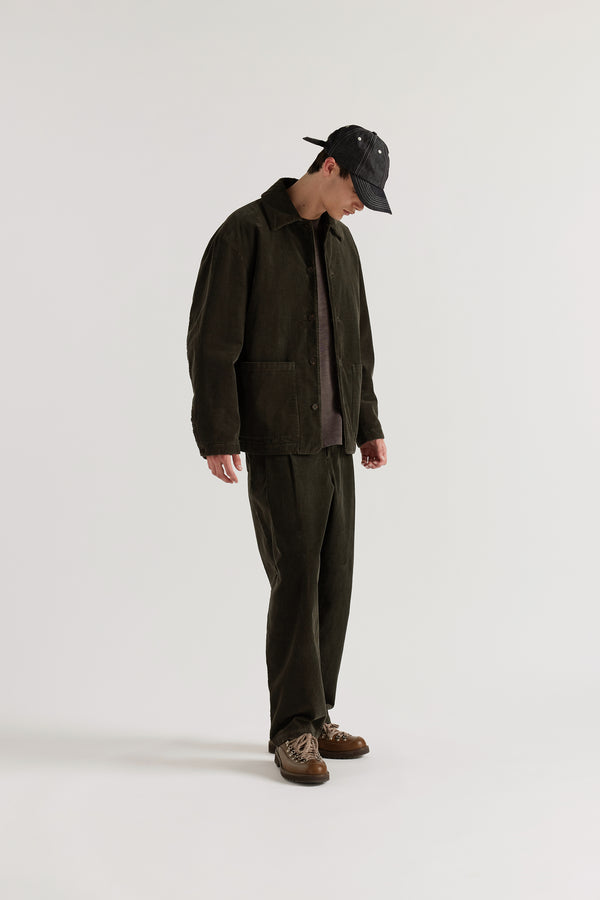 Three-quarter view of the Reverie Cord Jacket in Brown showing husky silhouette, patch pockets and double over-dyed cotton corduroy in deep brown