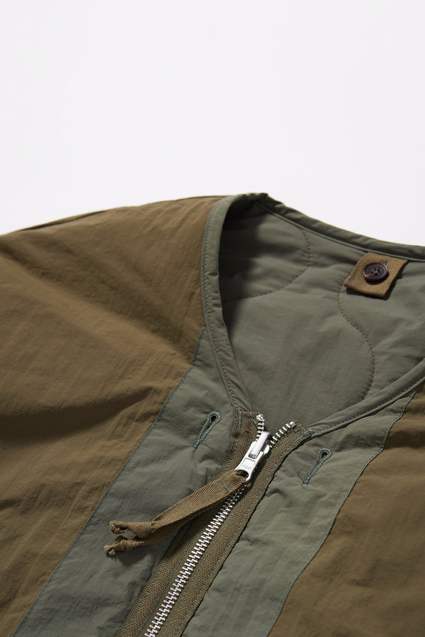 Close up of the the Olive plain-side out, showing a clean minimalist finish
