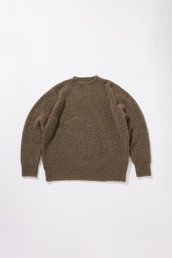 Flat Olive Spore Knit Sweater front view showing crew neck raglan silhouette, fluffy marle-flecked alpaca blend knit and exposed seam linking detail