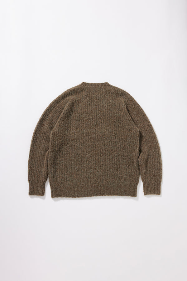 Flat Back view of the Spore Knit Sweater showing raglan sleeve construction, exposed seam linking and fluffy alpaca blend reverse cardigan knitt