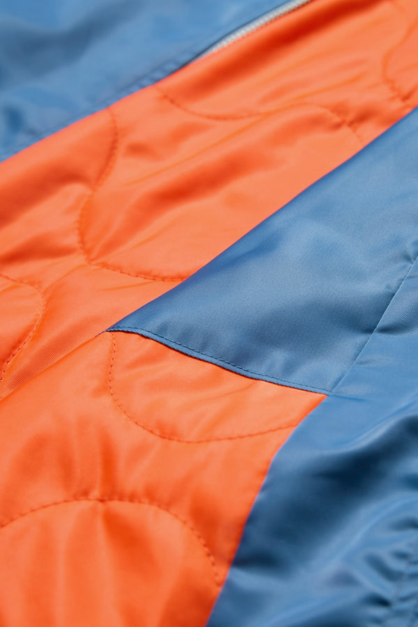 Like the original MA-1 Bomber Jacket, the Strata Bomber Jacket Blue has orange quilted lining. 