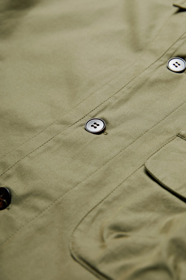 The Territory Overshirt Olive is a buttoned up overshirt made from a mid-weight cotton drill and has a topstitched placket.