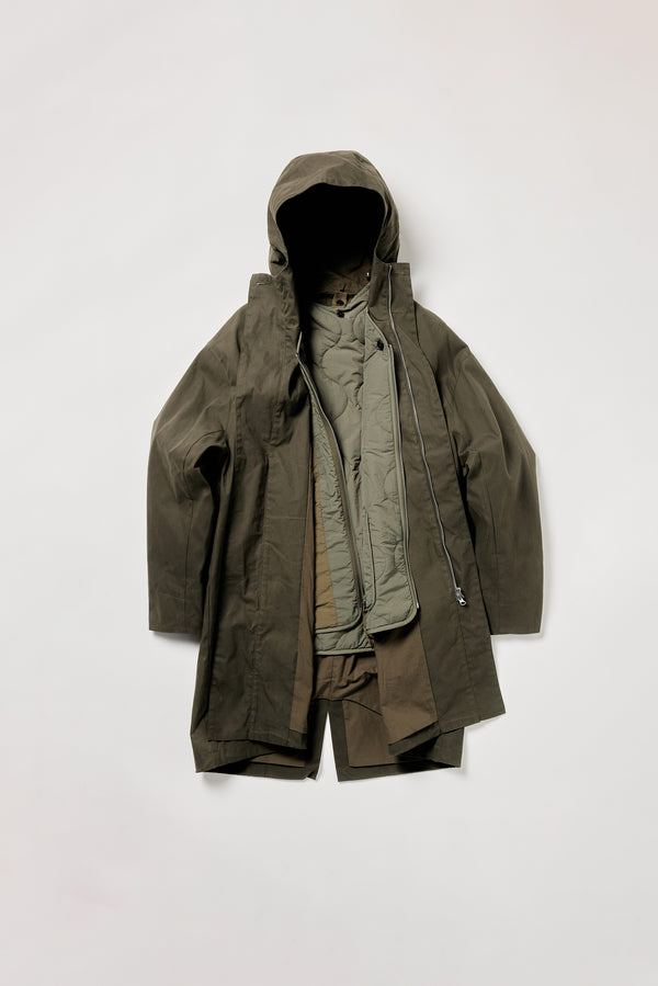 Flat lay of Time Parka in Olive shown with hood and front button closures and the Solstice Jacket attached 