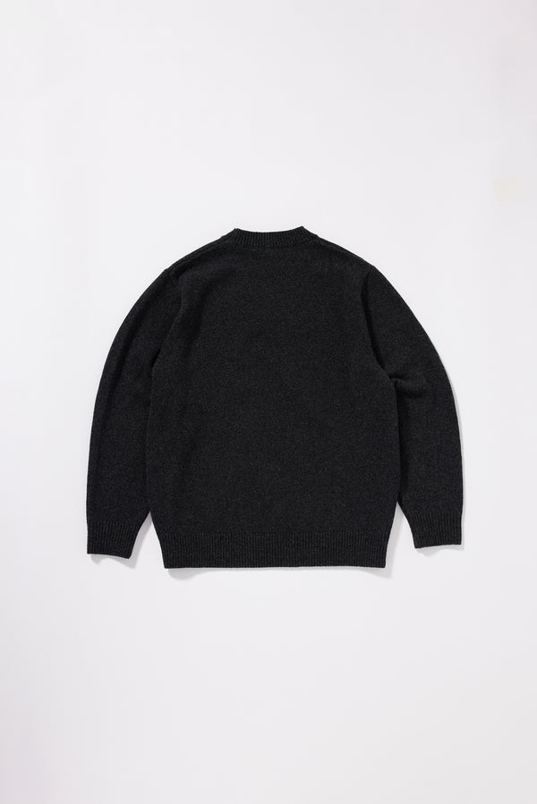 Back view of the Charcoal Vellum Knit Sweater showing classic crew neck silhouette in 100% extrafine RWS certified Merino