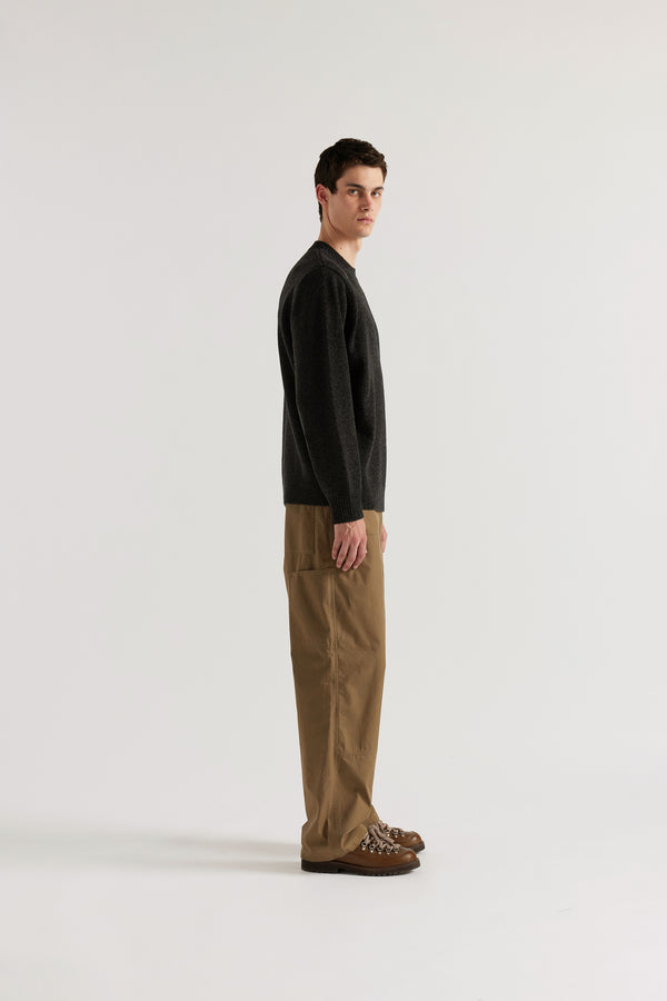 Side view of the Charcoal Vellum Knit Sweater showing minimal crew neck silhouette and fine extrafine Merino knit in a clean, timeless finish
