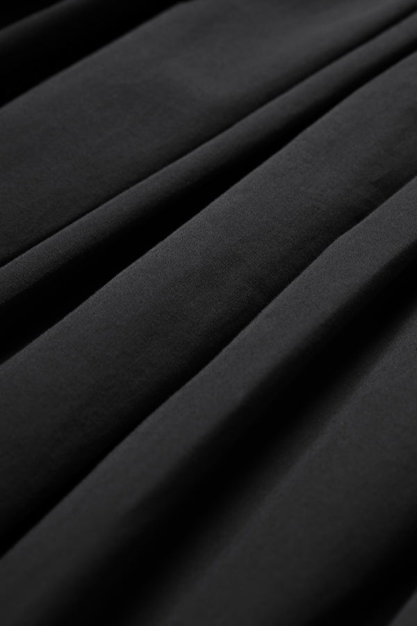 The Agora Dress Black is made from 100% cotton.