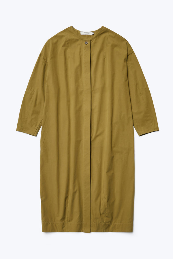 The front of the Agora Dress Moss Green with round neckline, straight hemline, concealed, button-through placket at the front and darted detailing.