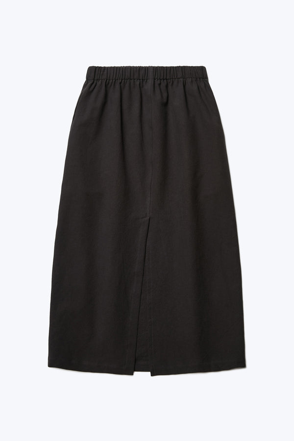 The back of the Anima Skirt Black, a straight style skirt with elasticated waistline, straight hem and back centre split.