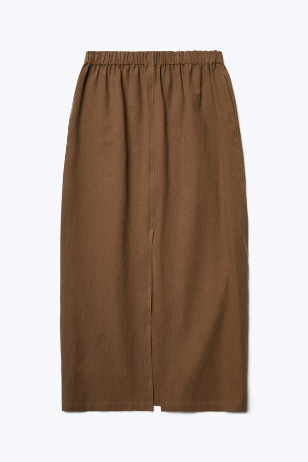 The back of the Anima Skirt Brown, a straight style skirt crafted from a soft textural cotton and featuring an elasticated waistline, straight hem and back centre split.