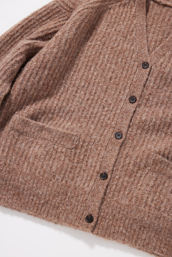 Close-up of the marle-flecked multi-directional rib knit texture on the Bloom Cardigan in Walnut alpaca blend