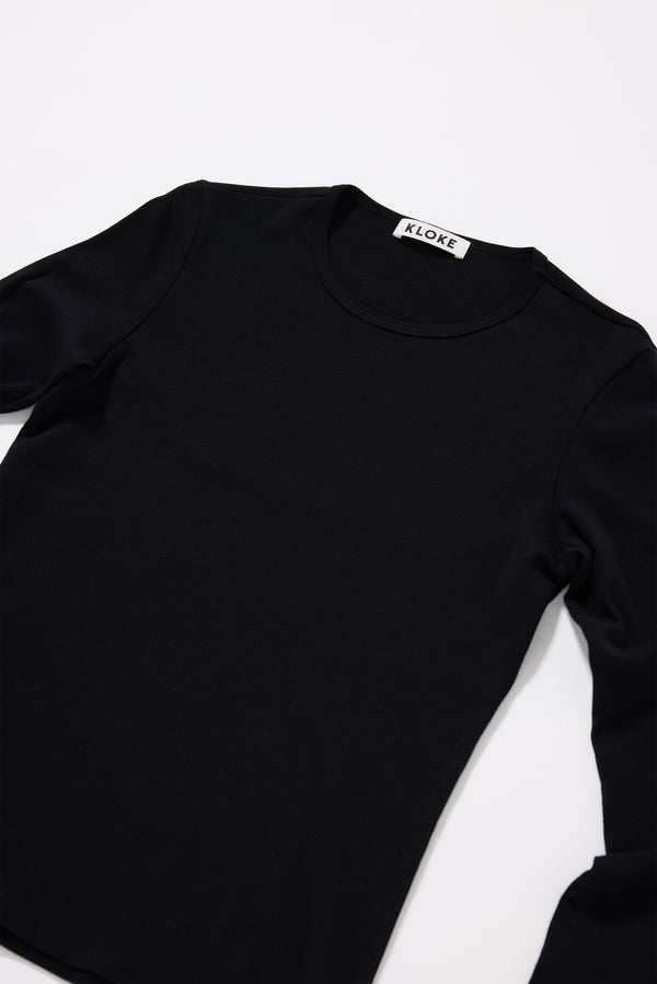 Close-up of 1x1 organic cotton rib texture on the Convex Long Sleeve Top in Black