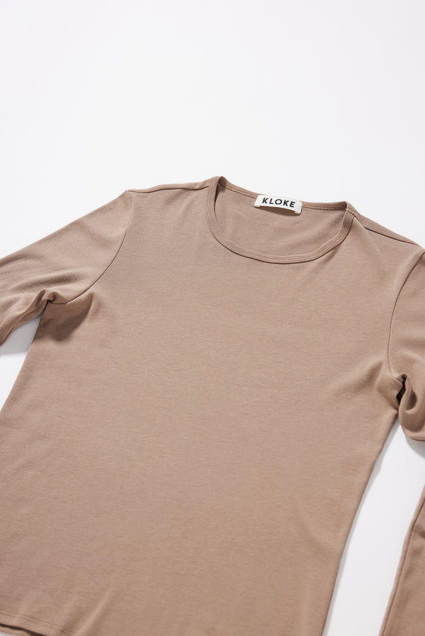 Close-up of 1x1 organic cotton rib texture on the Convex Long Sleeve Top in Fawn