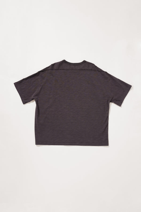 Flat Back view of the Overdyed Declare Tee in black licorice showing the relaxed silhouette.