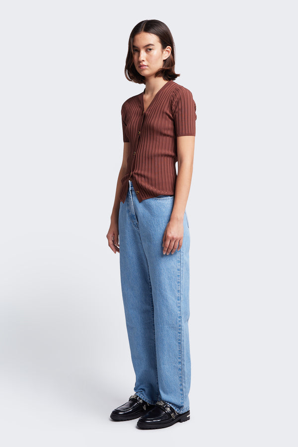 The Delay Short Sleeve Knit Cocoa a slim fit, V neck button up knit in a rib texture detail styled with the Evade Straight Leg Jean Light Blue.